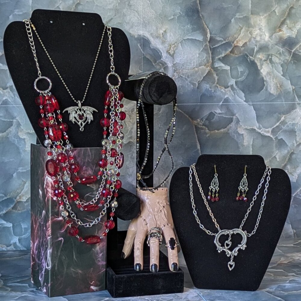 9 piece Jewelry Set: 3 Necklaces, 4 Rings, 1 Necklace/Bracelet, and Earrings
